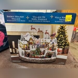 Snowy Holiday Village with Lights and Music